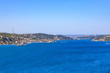 Fototapeta premium Scenic view of the bosphorus strait in istanbul with clear blue sky and urban landscape