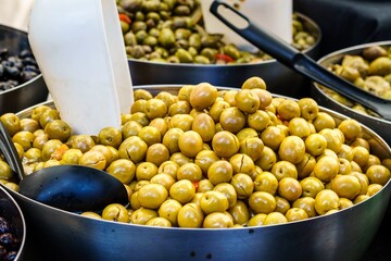 Spanish green olives for sale at a market stall