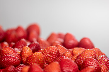 Many ripe red strawberries isolated against white background