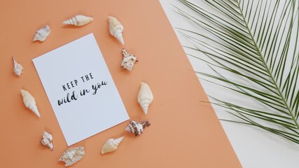 Wedding invitation card design with a bride and groom on a tropical beach with sand and the sea, featuring a flower and a rose illustration