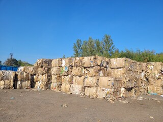 Compression cardboard and paper in a waste paper recycling plant, zero waste concept