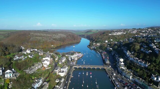 Looe, Cornwall, England: DRONE VIEWS: The drone flies over the course of the East Looe river showing West and East Looe. Looe is an ancient fishing port and popular UK holiday destination (6).