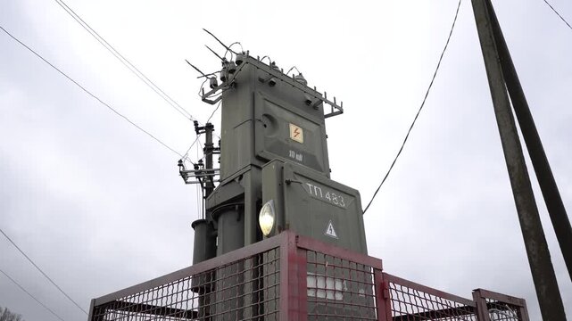 A powerful step-down transformer is connected to supply the load.