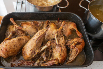 Freshly Roasted Duck Legs in a Roasting Pan, Ready to Serve