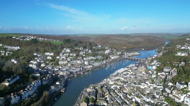 Looe, Cornwall, England: DRONE VIEWS: The drone flies over the course of the East Looe river showing West and East Looe. Looe is an ancient fishing port and popular UK holiday destination (5).