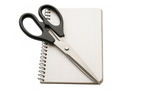Scissors resting on spiral notebook with transparent background