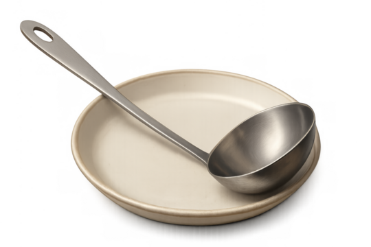 Stainless steel ladle resting on ceramic plate