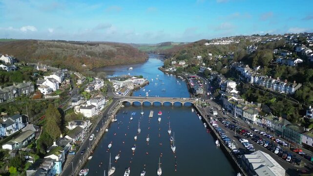Looe, Cornwall, England: DRONE VIEWS: The drone flies over the course of the East Looe river showing West and East Looe. Looe is an ancient fishing port and popular UK holiday destination (1).
