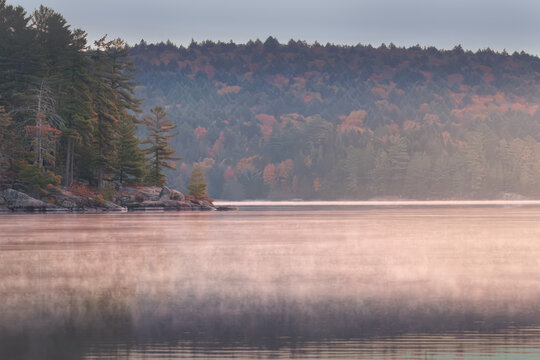 Northern ontario landscape of lake and tress during fall colour peak
