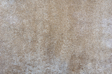 Fototapeta premium full frame close up of a beige speckled concrete surface showing uniform grainy texture for construction, architecture, and concept of interior design