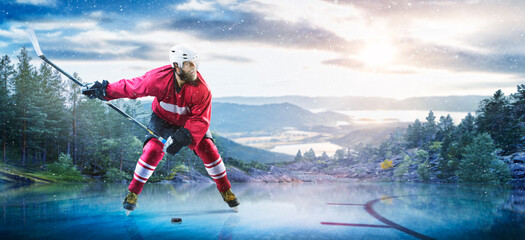 Hockey players in action on the ice. Outdoor game. Sports. Hockey match. A large hockey rink in the middle of an forest. Hockey concept. Panorama