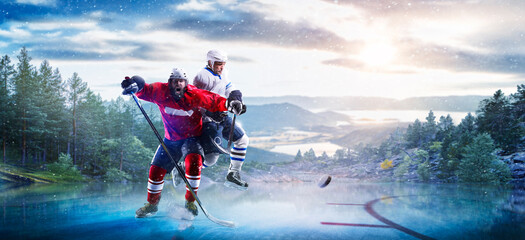 Hockey players in action on the ice. Outdoor game. Sports. Hockey match. A large hockey rink in the middle of an forest. Hockey concept. Panorama