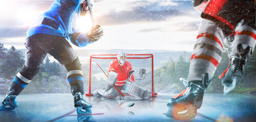 Hockey players in action on the ice. Outdoor game. Sports. Hockey match. A large hockey rink in the middle of an forest. Hockey concept. Panorama