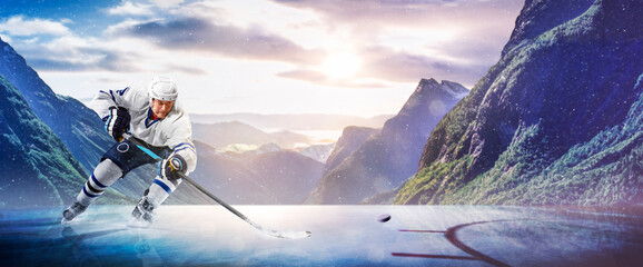 Hockey players in action on the ice. Outdoor game. Sports. Hockey match. A large hockey rink in the middle of an forest. Hockey concept. Panorama