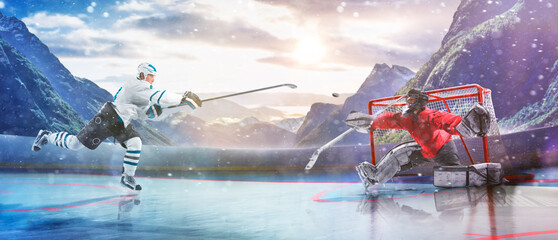 Hockey players in action on the ice. Outdoor game. Sports. Hockey match. A large hockey rink in the middle of an forest. Hockey concept. Panorama