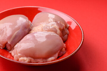 Chicken thigh fillet, skinless and boneless meat for grilling or barbecue. Chicken thigh fillet