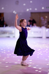 Children competing in dance competition in elegant outfits