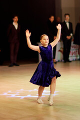 Children competing in ballroom dance event