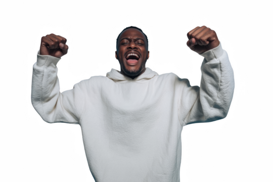 Excited African American man cheering with raised fists celebrating success and victory isolated on white - Powered by Adobe