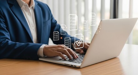 A businessman in a blue suit working on a laptop, surrounded by digital file icons, symbolizing productivity and technology.