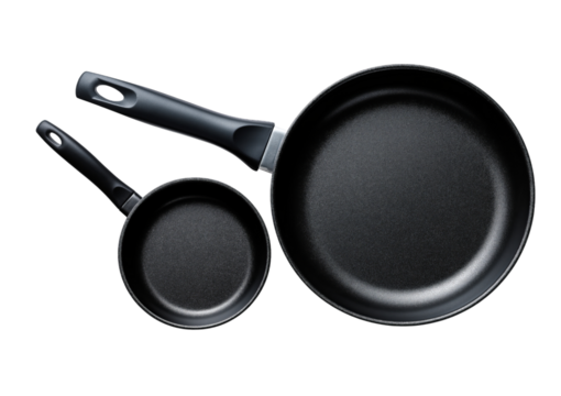 Two black skillets one small one large isolated on a transparent background