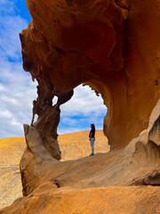 Young Woman Exploring the Arches of Las Peñitas, Fuerteventura