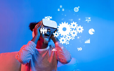 A young person engages with a virtual reality headset, enhancing teamwork and connectivity in a...