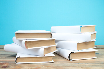 open book, books on the blue background. Back to school. Education. Copy space for text.