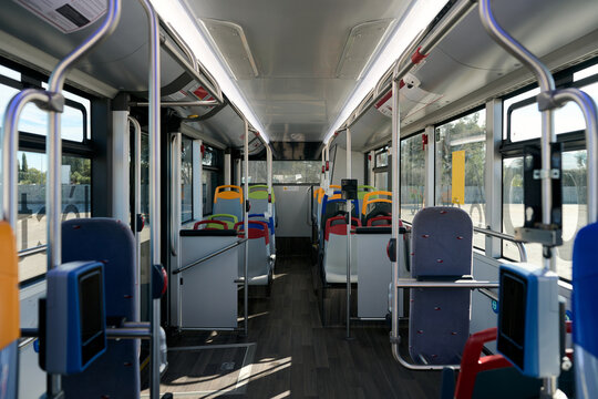 Empty bus interior with colorful seats for public transport