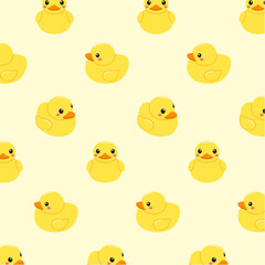Seamless pattern of cute yellow rubber ducks on a light yellow background for children. Funny wallpaper with toys for the bathroom,