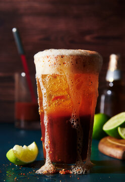 michealada cocktail with beer, tomato juice, lime 
