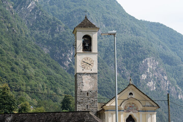 Lavertezzo, Switzerland - August 14, 2025: Beautiful village Lavertezzo and the crystal clear and calm waters of the Verzasca stream. A popular tourist destination in Ticino, Switzerland.