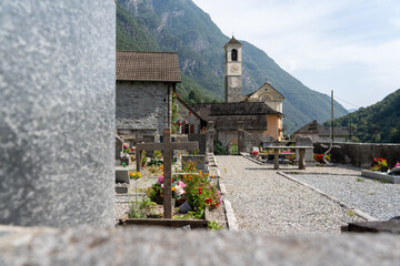 Lavertezzo, Switzerland - August 14, 2025: Beautiful village Lavertezzo and the crystal clear and calm waters of the Verzasca stream. A popular tourist destination in Ticino, Switzerland.