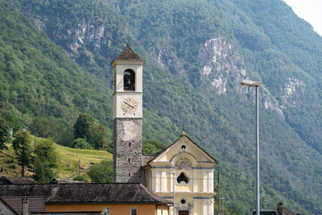 Lavertezzo, Switzerland - August 14, 2025: Beautiful village Lavertezzo and the crystal clear and calm waters of the Verzasca stream. A popular tourist destination in Ticino, Switzerland.