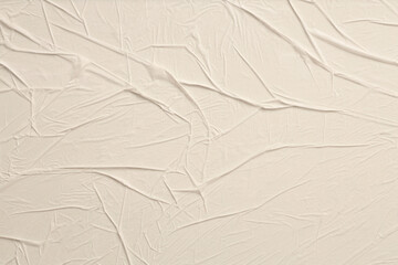Empty crumpled wet craft paper blank texture relief wall texture background. Gray beige neutral color.