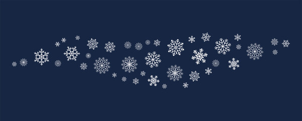 Small wave accent of white snowflakes on navy background. Minimalist frosty winter detail for seasonal cards, graphics and holiday visual projects