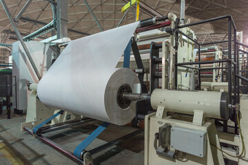 Jumbo rolls in a paper factory workshop.