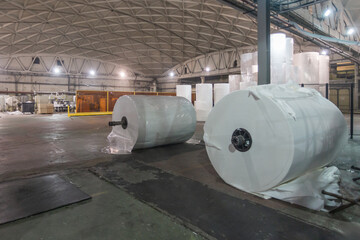 Jumbo rolls in a paper factory workshop.
