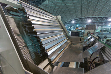 Closeup view of core machine at paper factory.