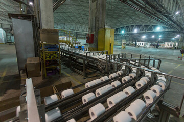 A conveyor belt at a toilet paper factory.