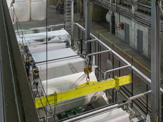 Jumbo rolls in a paper factory workshop.