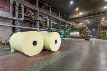 Jumbo rolls in a paper factory workshop.