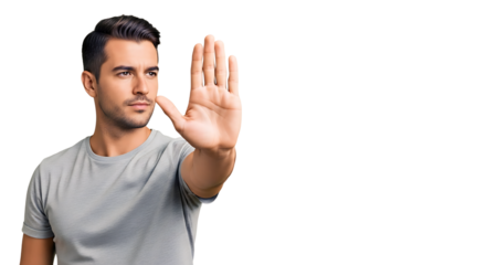 Serious young man gesturing stop with his hand, conveying a message of caution and warning