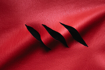 red leather with cuts and scratches