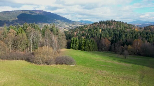 Beskidy Mountains. Picturesque Valley and Forested Hills in Warm Autumn Sunlight. Rabka-Zdr&oacute;j, Poland
