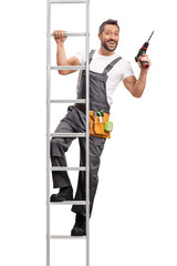 Repairman holding a drilling machine and standing on a ladder