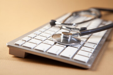 Stethoscope on a laptop keyboard. Medical concept. Selective focus.