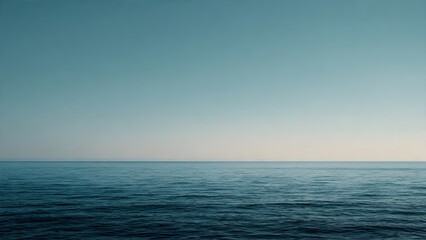 Obraz premium Serene Seascape at Horizon Under a Clear Blue Sky