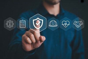 Man pointing to a shield icon with checkmark surrounded by other safety related icons on dark background