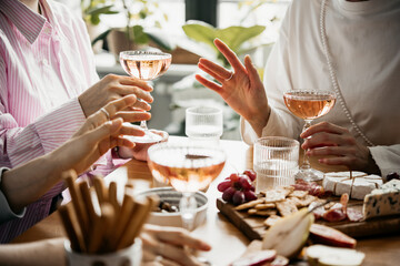 Glasses of rose wine seen during a dinner party of a celebration.